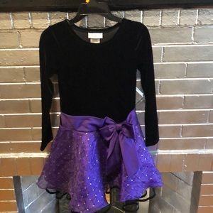 A purple long sleeve formal dress